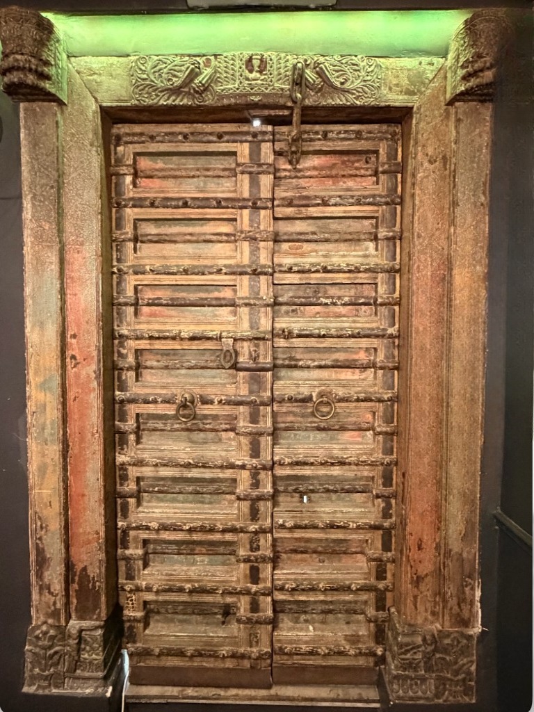 Ornate carved antique doors at Opium — film and photo location Cape Town