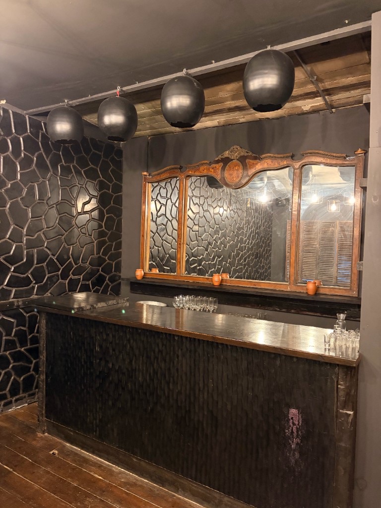 Private bar with geometric feature wall