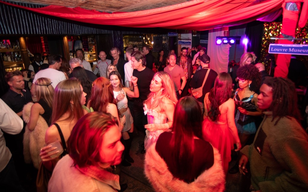 Packed lounge event with neon lighting — mobile production capability